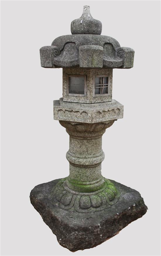 A carved granite garden lantern, H.4ft 5in. width of plinth 2ft 1in.